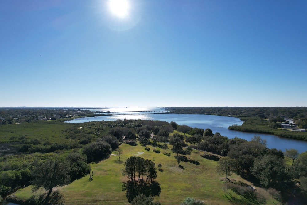 an aerial view of a lake surrounded by trees