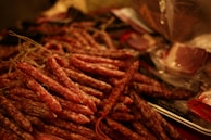 A selection of sausages hanging in a butcher shop.