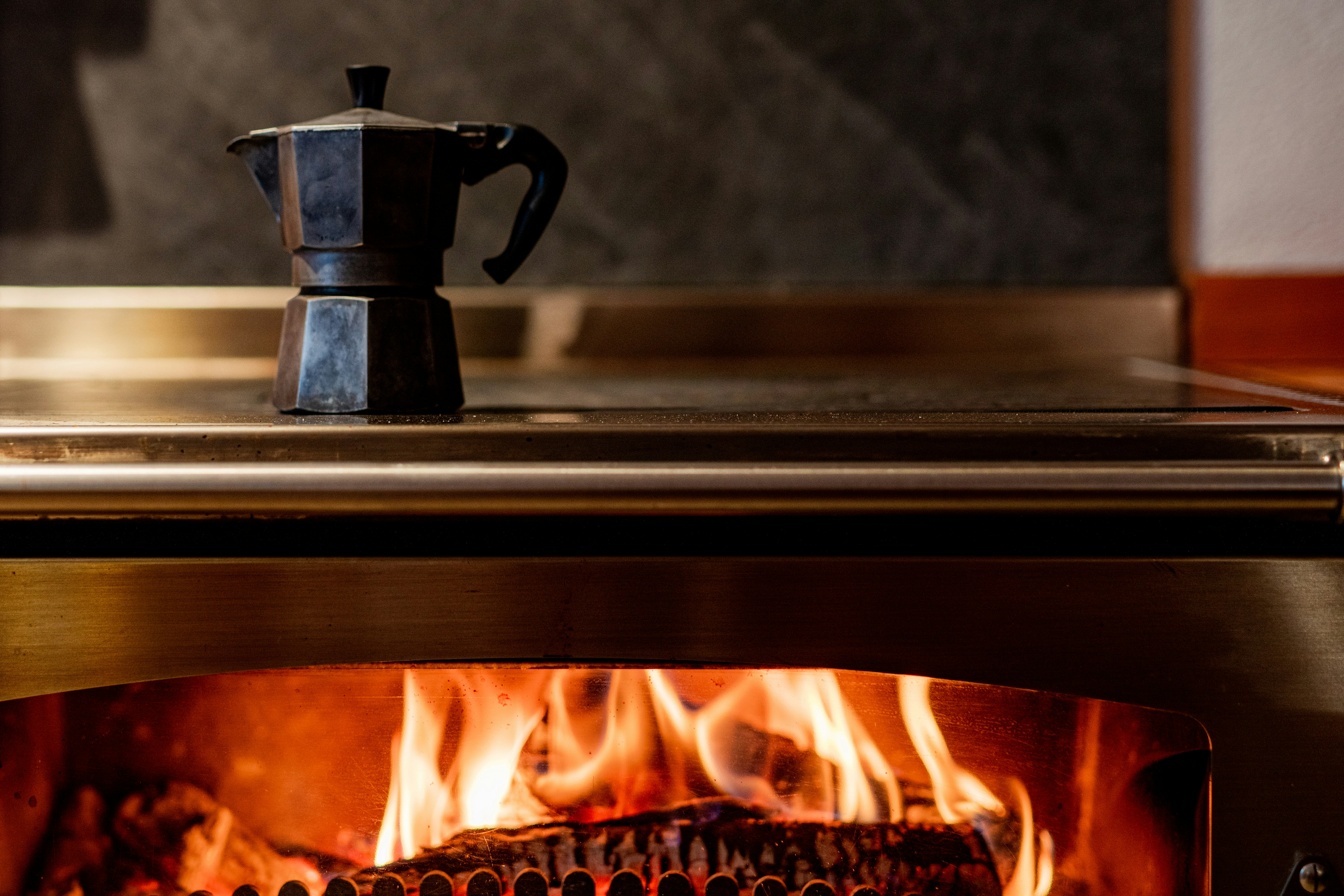 a stove with a coffee pot on top of it