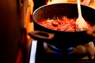 A warm meal being prepared in a home kitchen.