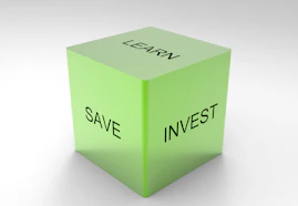 A green 3D cube with the words 'LEARN', 'SAVE', and 'INVEST' on its visible sides, set against a plain white background.