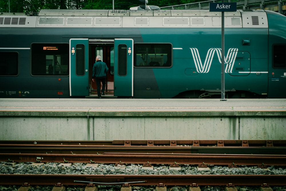 a man standing in the doorway of a train