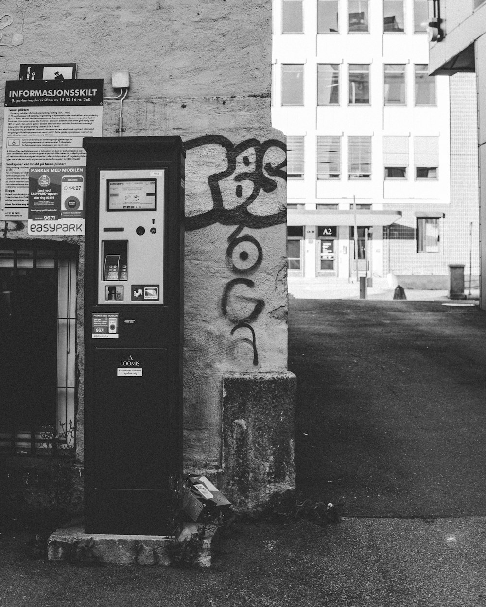 a black and white photo of a phone booth