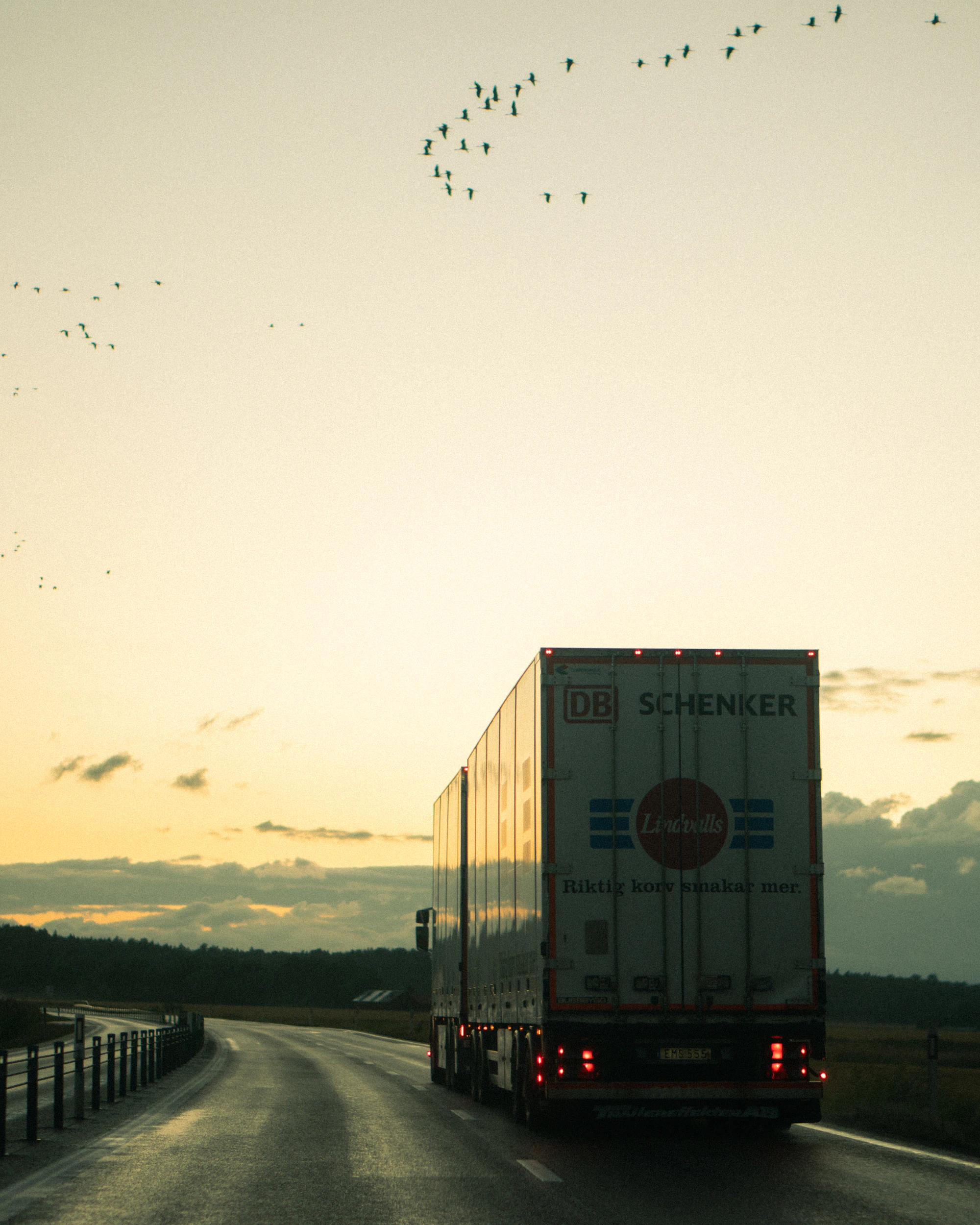 Transport truck on the highway at sunset
