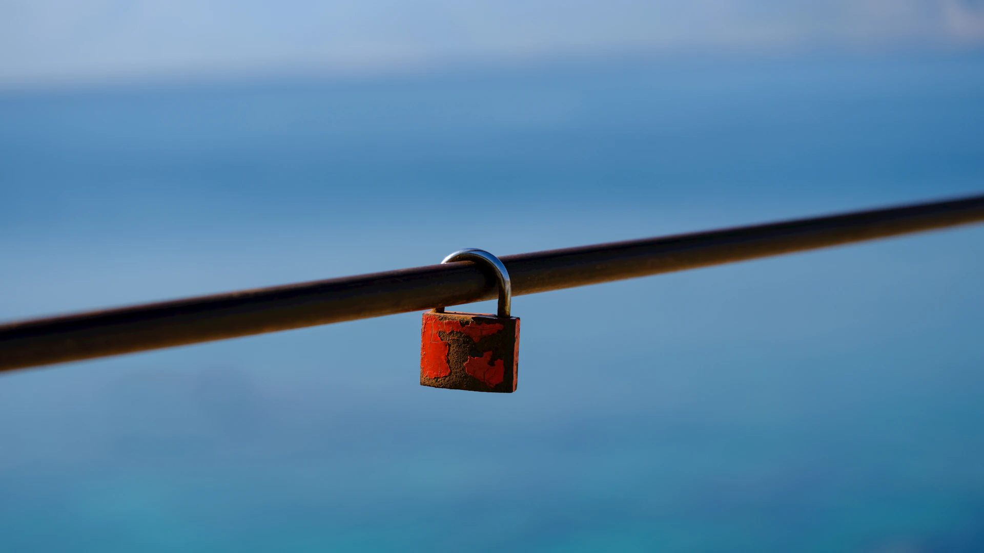 a close up of a padlock on a railing