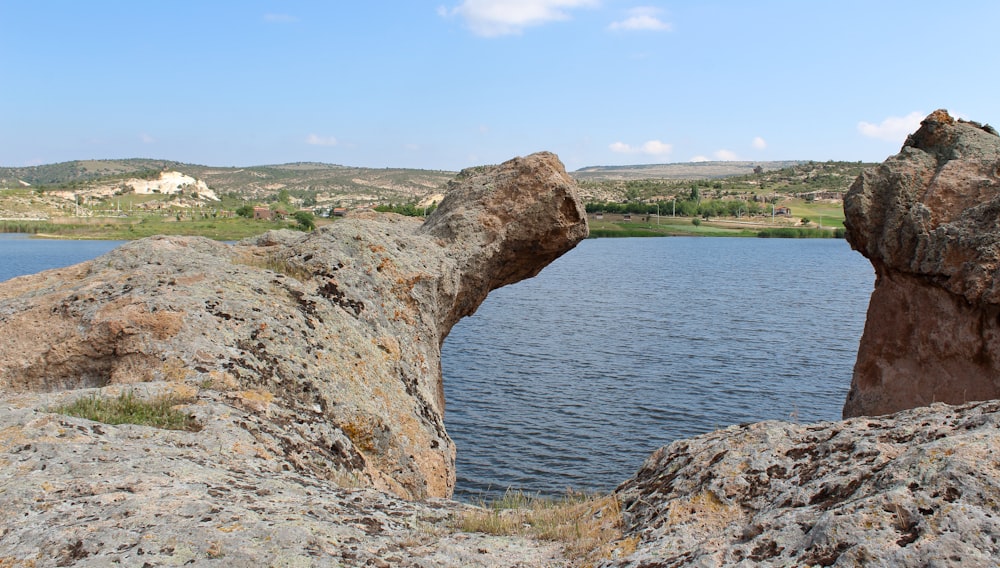 a view of a body of water from a rock formation