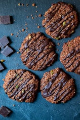 cookies with chocolate drizzled on top of them