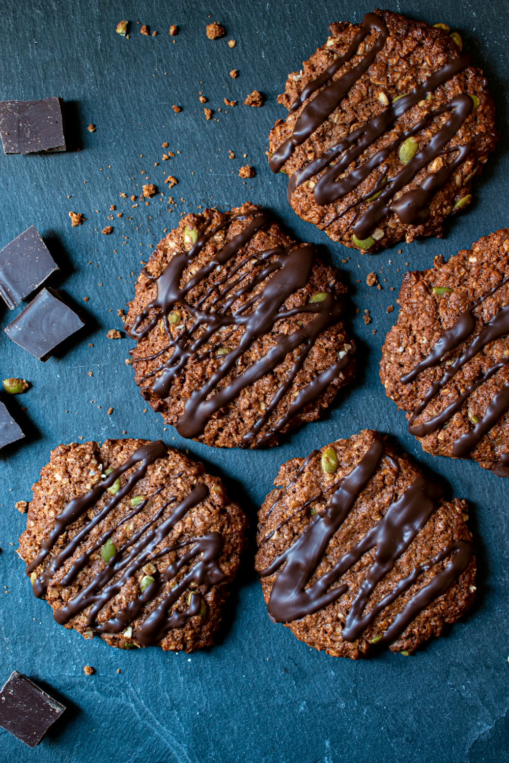 cookies with chocolate drizzled on top of them