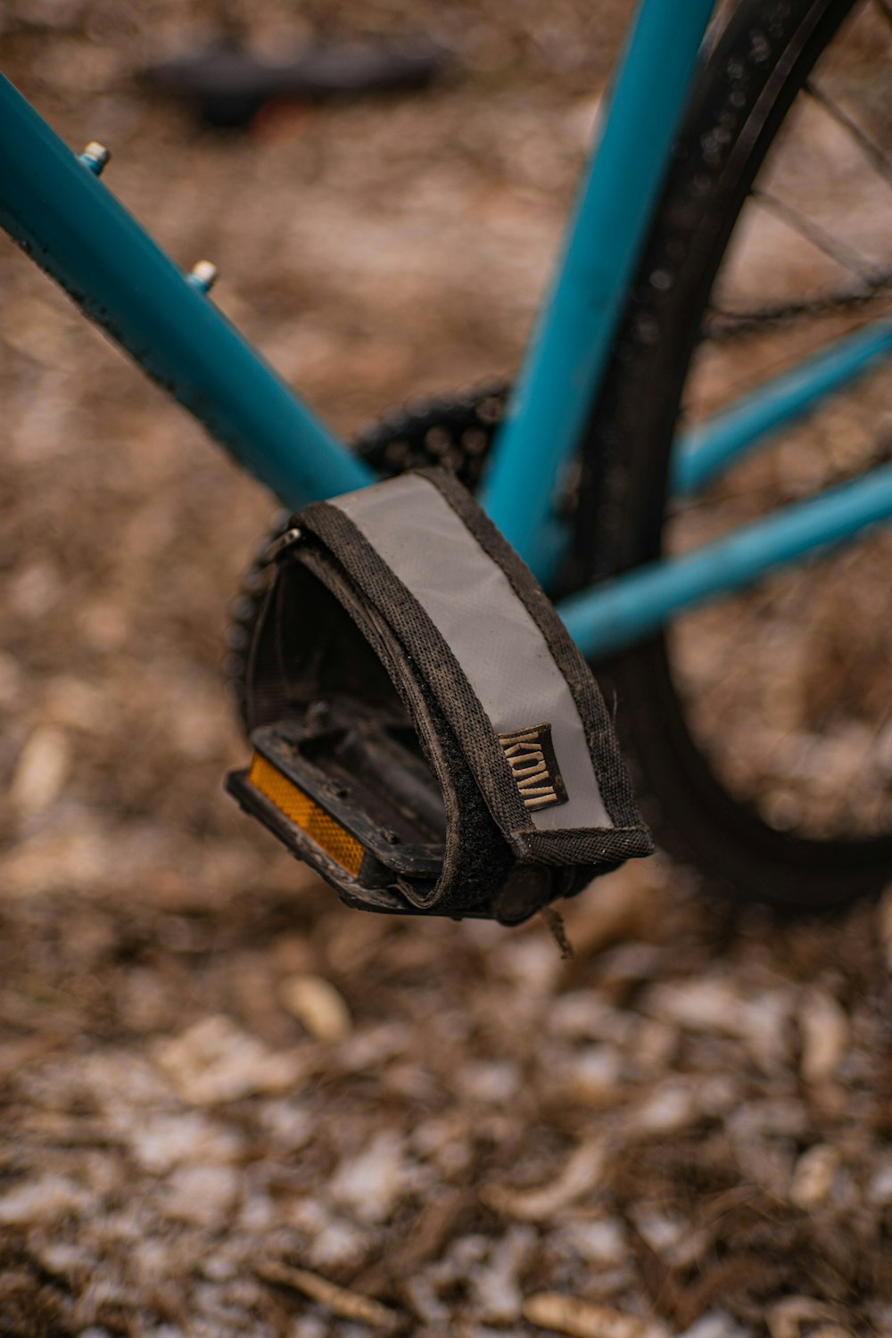 a close up of a bike tire with a bag on it