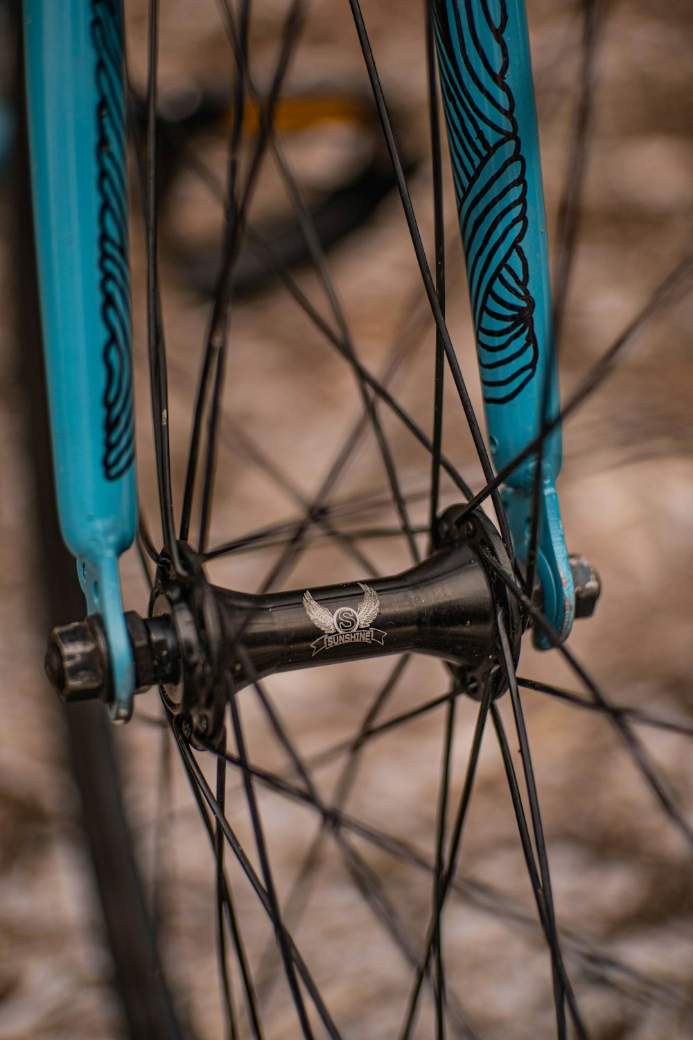 a close up of the spokes of a bicycle