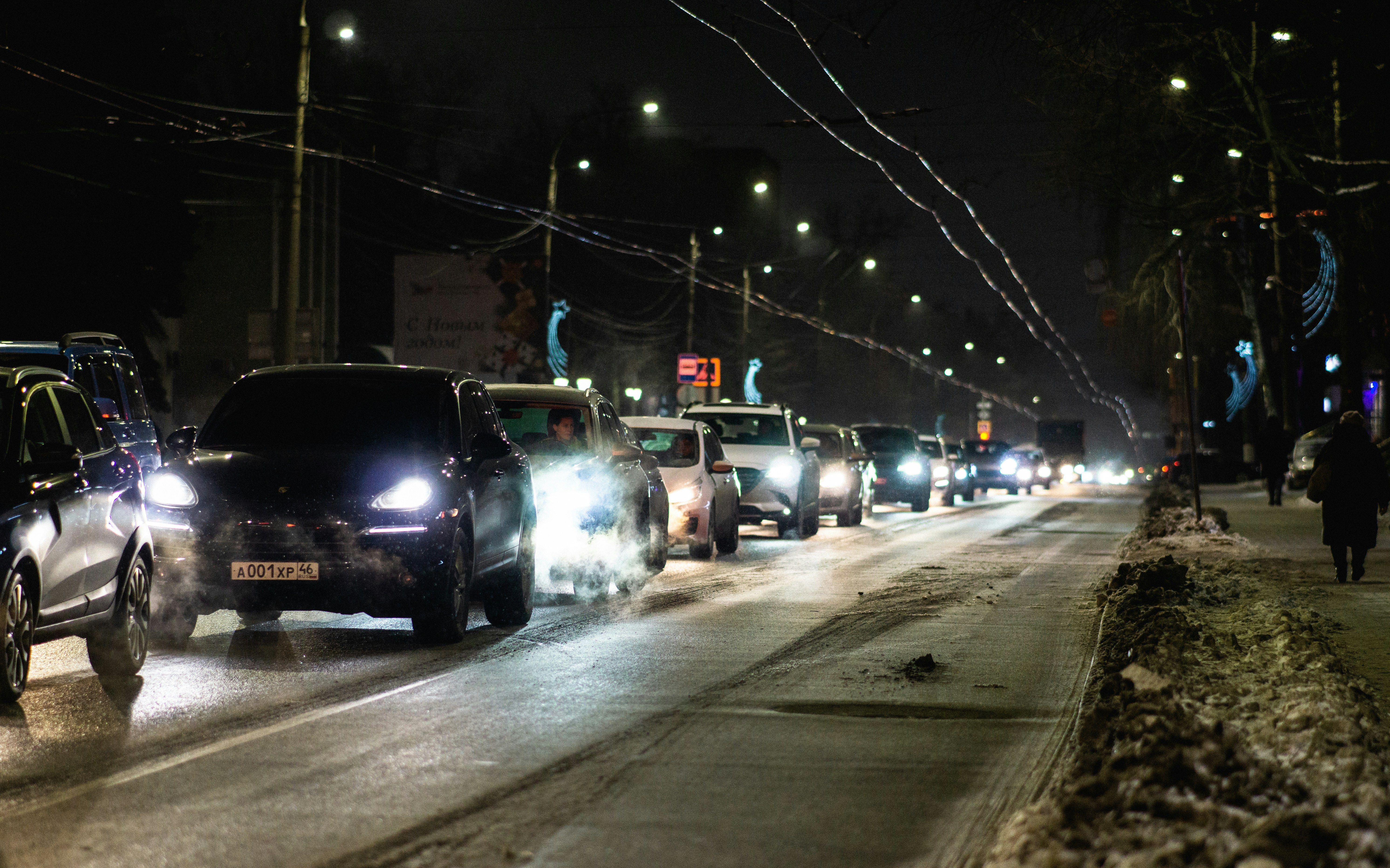 GMC Hummer EV electric pickup truck driving off-road on rocky terrain