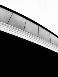 Architectural detail showing the integration of aluminum and glass in a stylish facade.