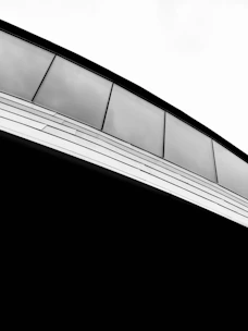 Architectural detail showing the integration of aluminum and glass in a stylish facade.