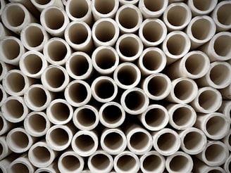 White UPVC pipes arranged in a clean, organized display.