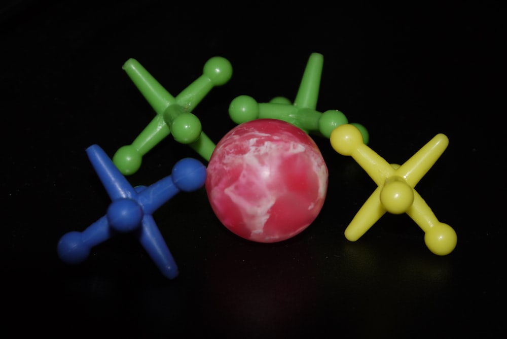 a group of plastic toys sitting on top of a table