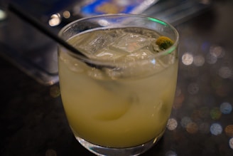 Colorful cocktail with ice cubes in a stylish glass.