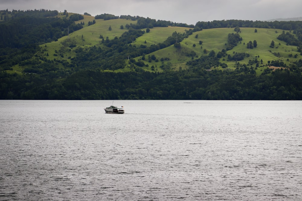 a boat in the middle of a large body of water