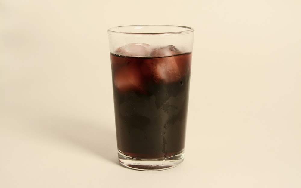 a glass of ice tea on a white background