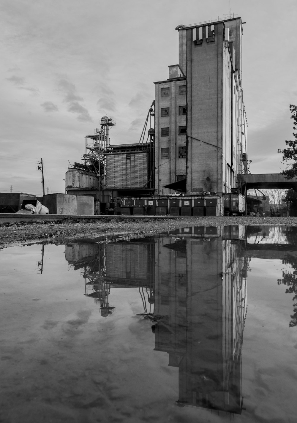 a black and white photo of a factory building