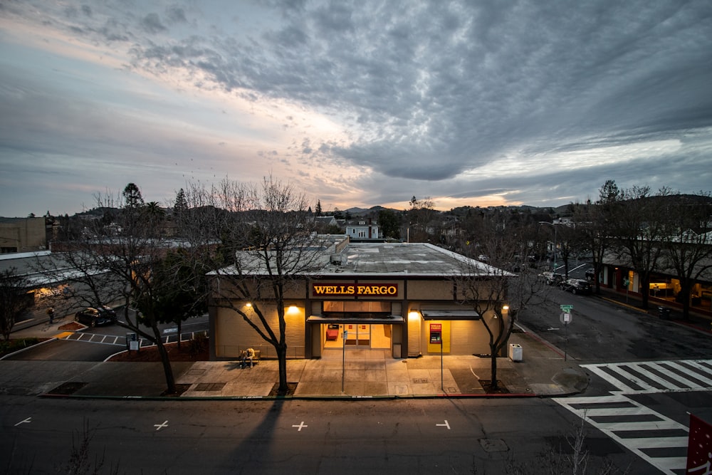 a building with a cloudy sky in the background