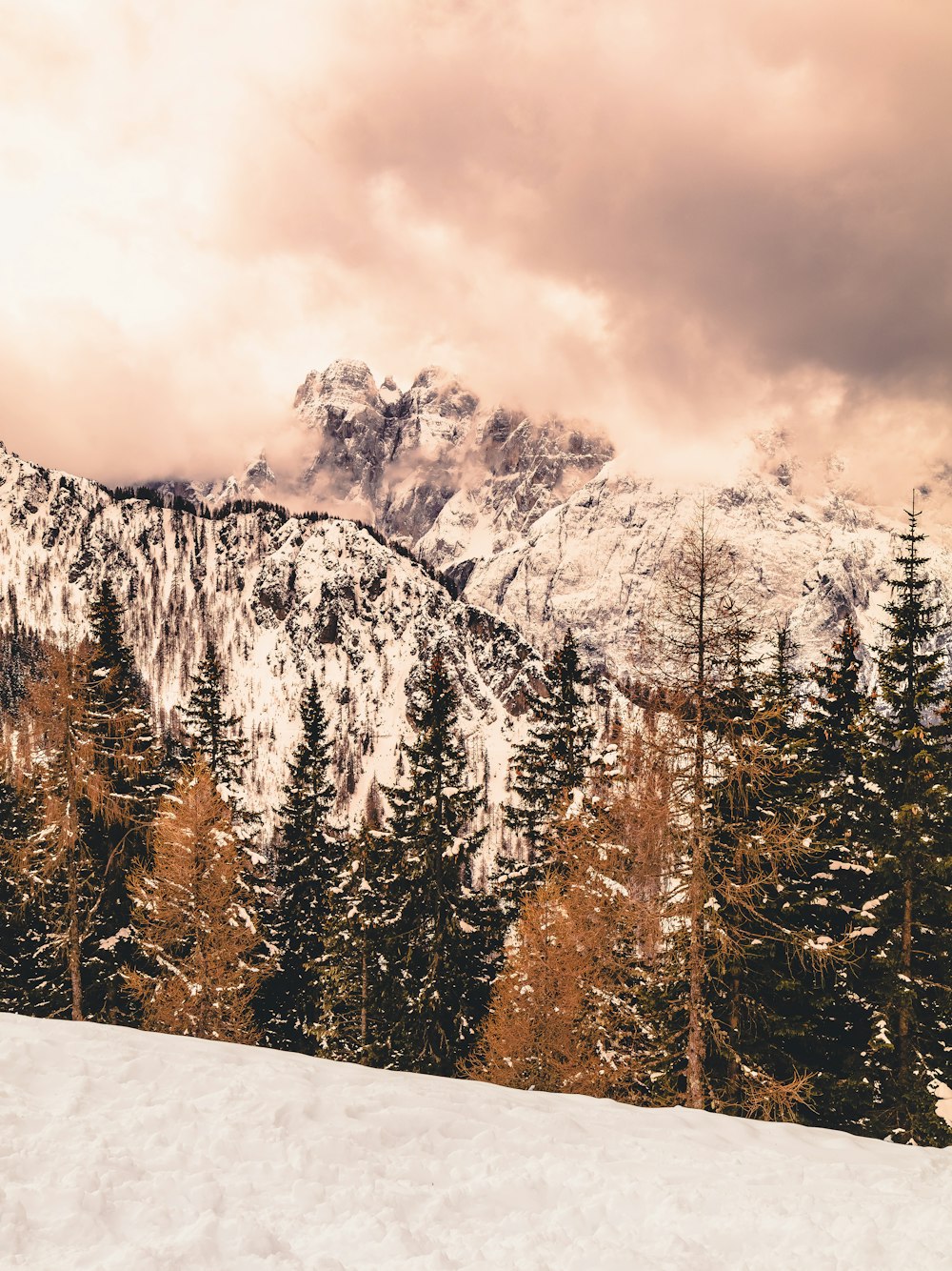 a man riding skis on top of a snow covered slope