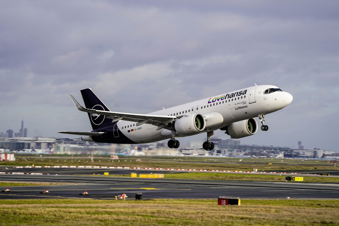 a large jetliner taking off from an airport runway,