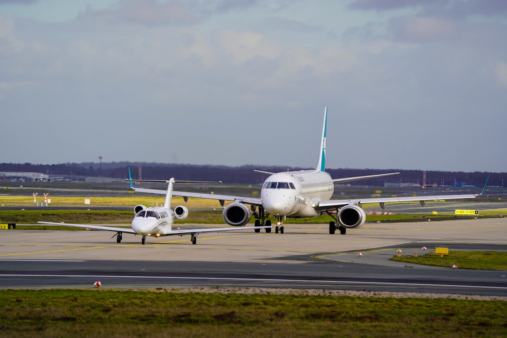 a large jetliner sitting on top of an airport runway