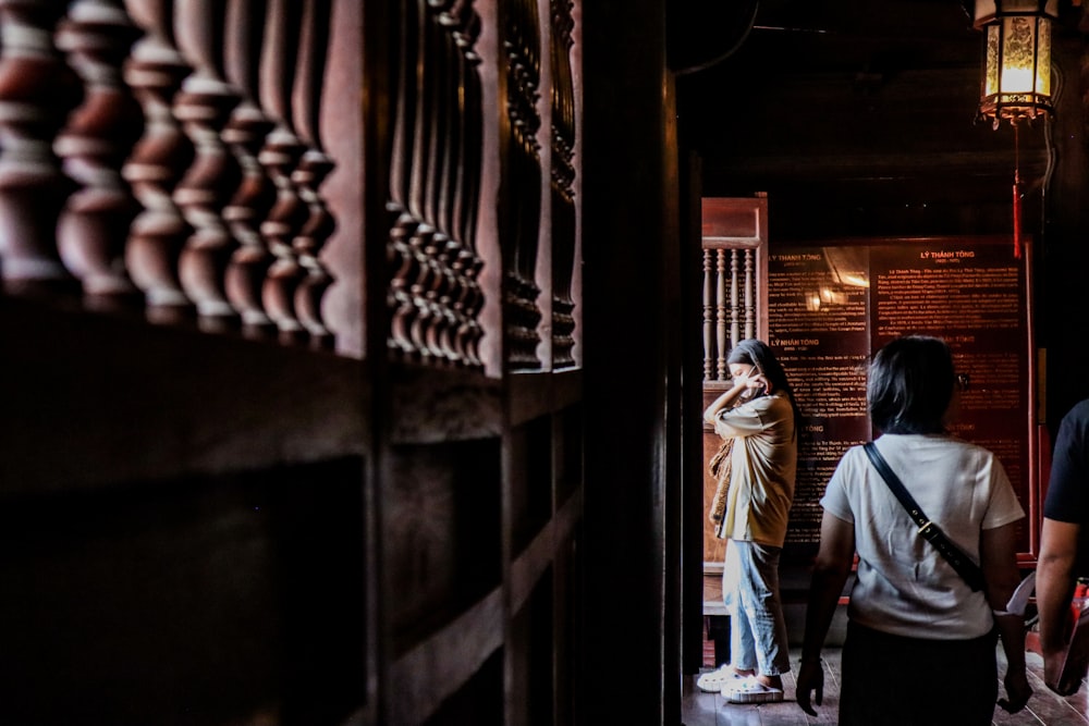 a group of people walking down a hallway