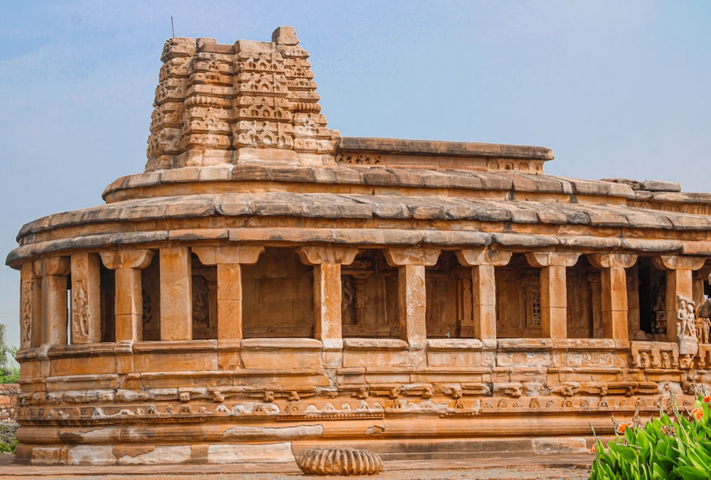 a large stone structure with statues on top of it