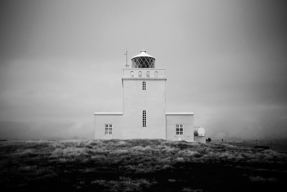 a black and white photo of a lighthouse