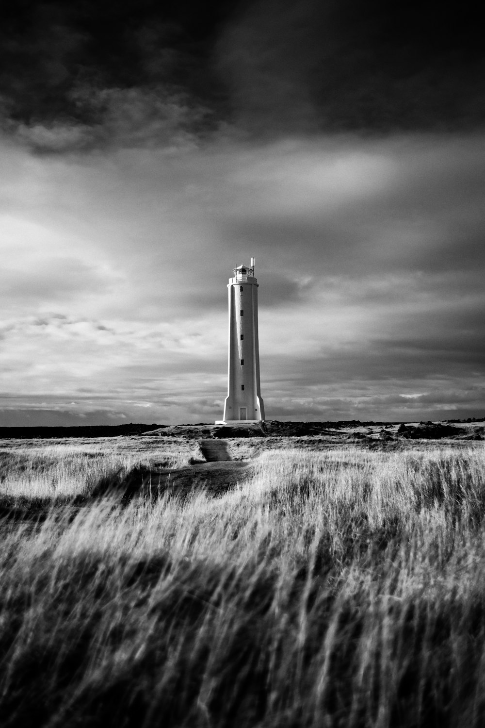 a black and white photo of a lighthouse