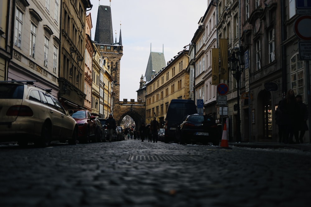 a city street with cars parked on both sides of it