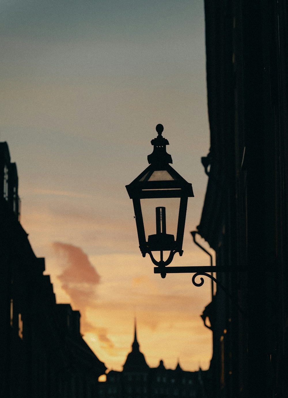 a street light hanging from the side of a building