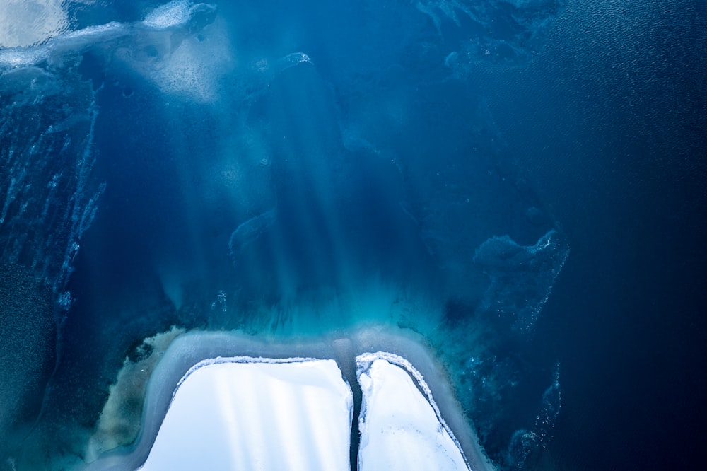 an aerial view of the water and ice