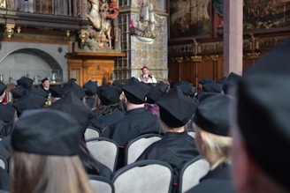 a large group of people in graduation caps and gowns