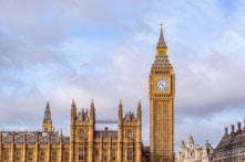 the big ben clock tower towering over the city of london