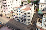 an aerial view of a Kumasi city street and buildings