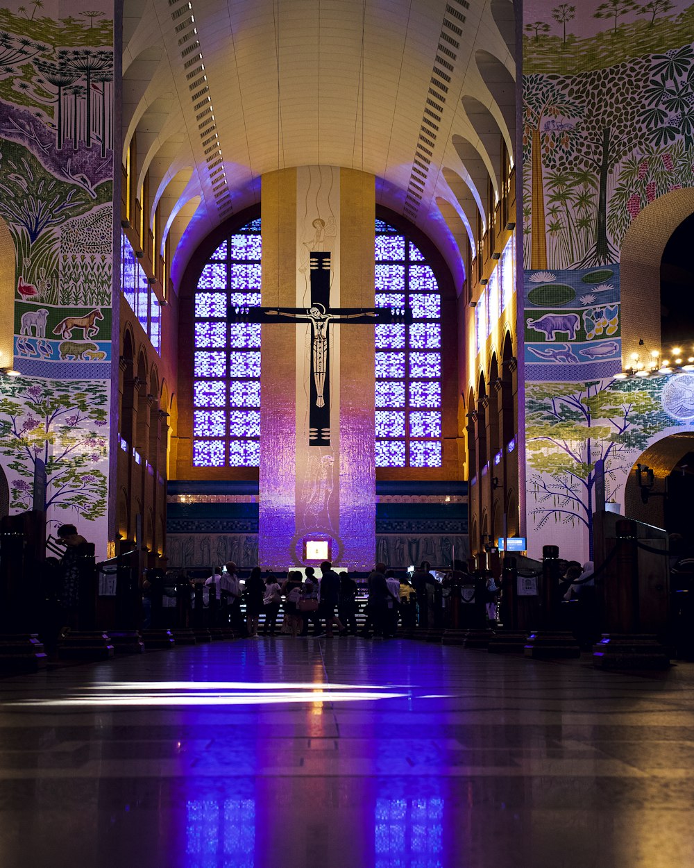 a church with a cross hanging from the ceiling