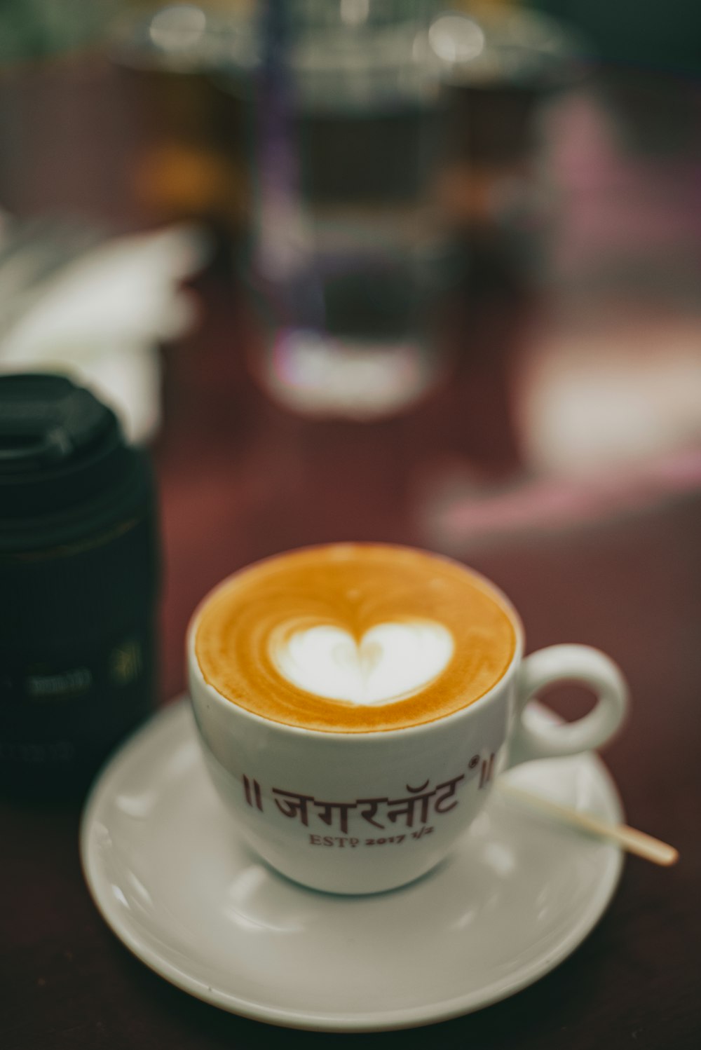 a cup of coffee with a heart on it