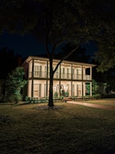 A well-maintained Birmingham rental property exterior with welcoming lighting.