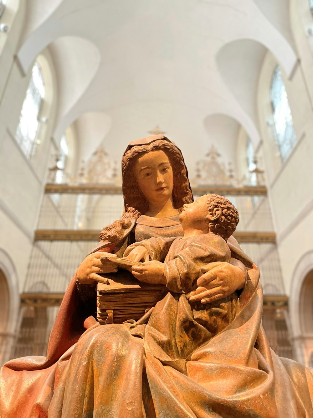 a statue of a woman holding a child