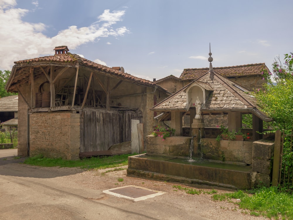 an old building with a water fountain in front of it