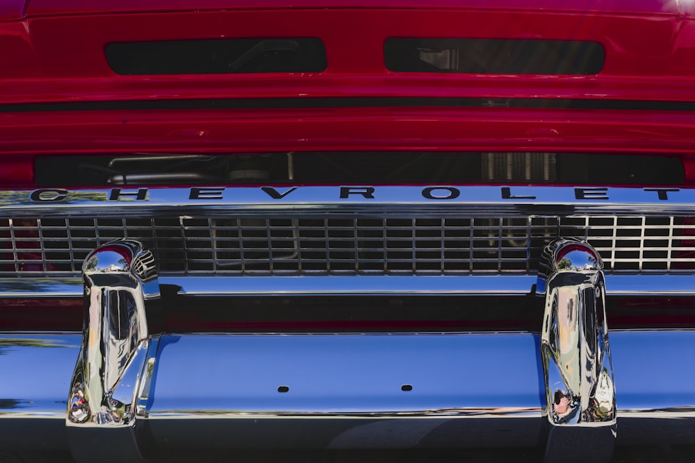 the front end of a red chevrolet car
