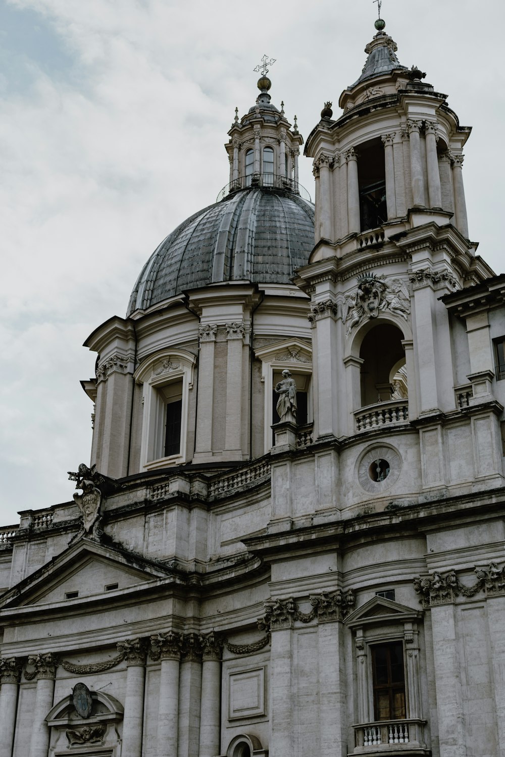 a large white building with a clock on it's side