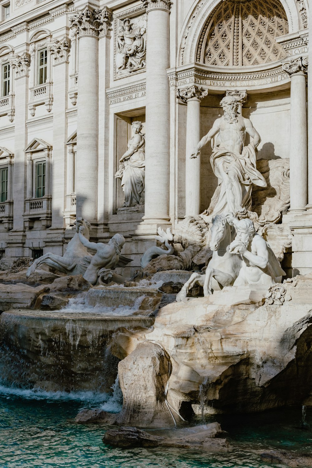 a large building with a fountain in front of it