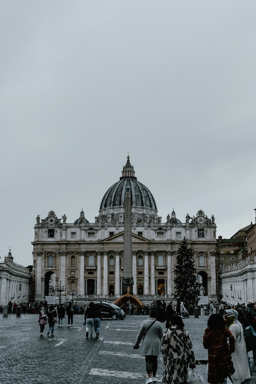 a group of people standing in front of a building