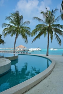 Before and after images of a pool with a new dry beach area added, highlighting the transformation.