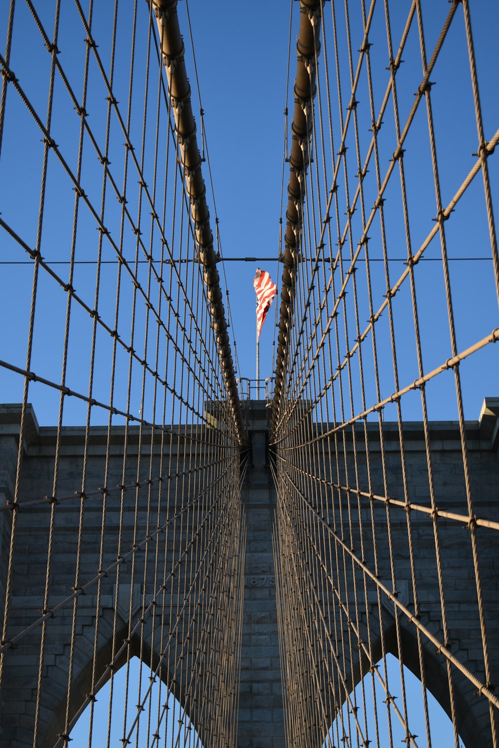 a view of a bridge with a flag on top of it