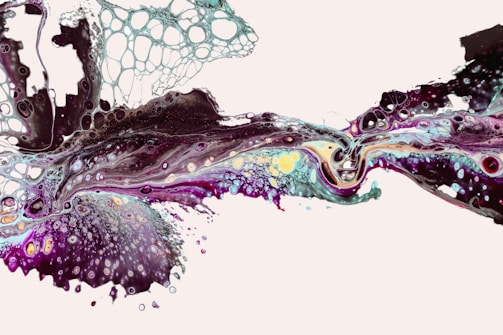 An abstract liquid art piece with dynamic swirling patterns. The flow contains a mix of dark and bright colors, creating a marbled effect with cells and bubbles forming unique textures. The composition feels fluid and organic, with intricate details and a harmonious blend of colors.