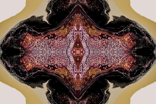An abstract symmetrical pattern featuring intricate textures and colors. The design is predominantly dark with a central section that is lighter, resembling organic matter or possibly cosmic structures. The overall pattern creates a sense of depth and complexity.